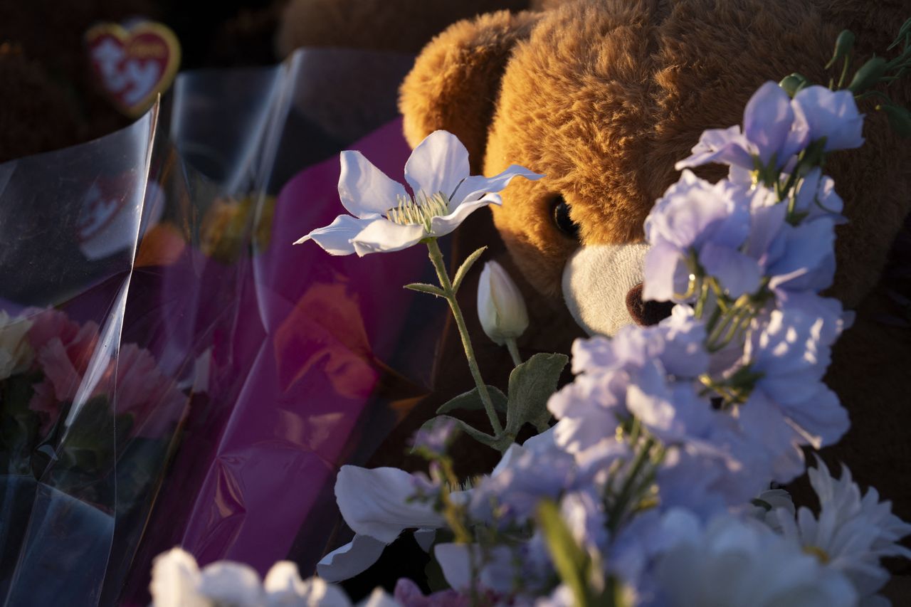 ANP-Candles, flowers, photographs, plush toys and other items at a makeshift memorial for the victims 4 days after a deadly mass shooting took place at a school, in the town of Tumbler Ridge Paige Taylor White